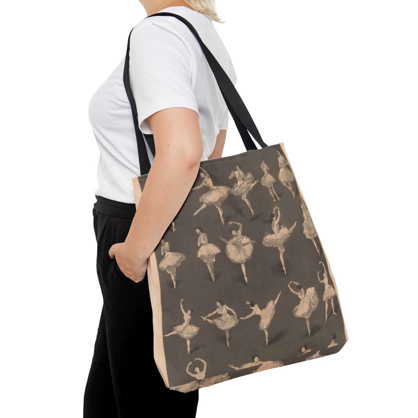 Ballet dancers' Large tote bag Cream colored sketches of ballet dancers in various positions on a brown background. Pictured on the shoulder of a woman wearing a white t-shirt and black pants