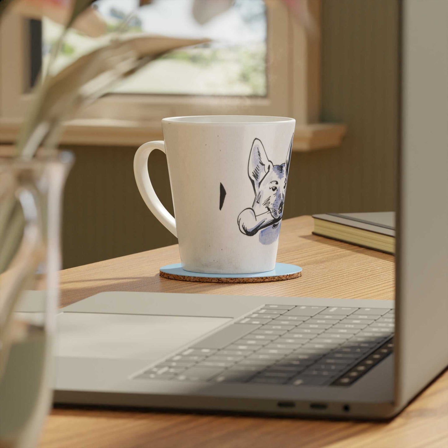 'Dog and Bone' scratch resistant ceramic Latte Mug with c shaped handle 12oz - scratch resistant 'Cycling' Latte Mug, 12oz - Free shipping in Canada. in a bue and white illustration depicting a dog with a bone in his mouth illustration. Pictured on a wooden desk beside an open laptop computer