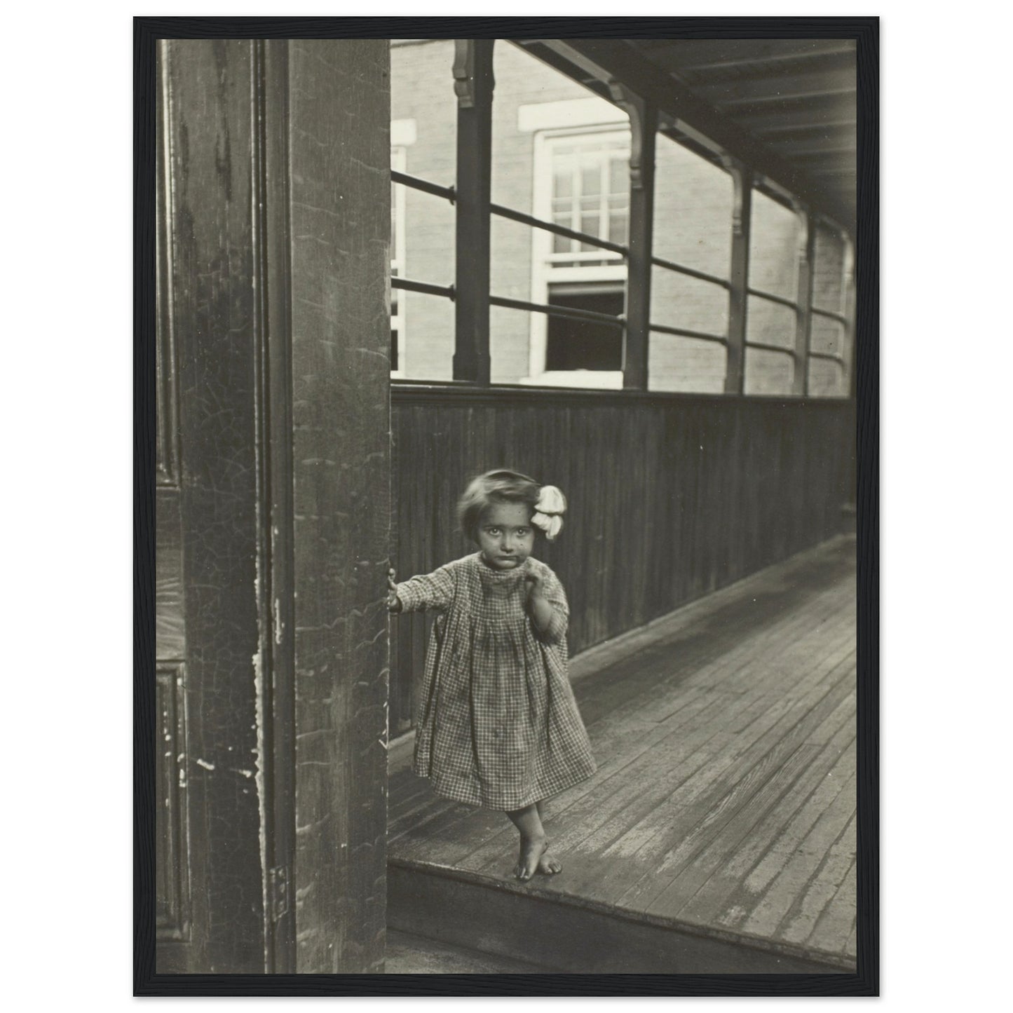 'Little Girl Standing at the Entrance to the Gallery' Photo Poster - Acid Free Matte Paper 18 x 24 inches (Black Wooden Framed)