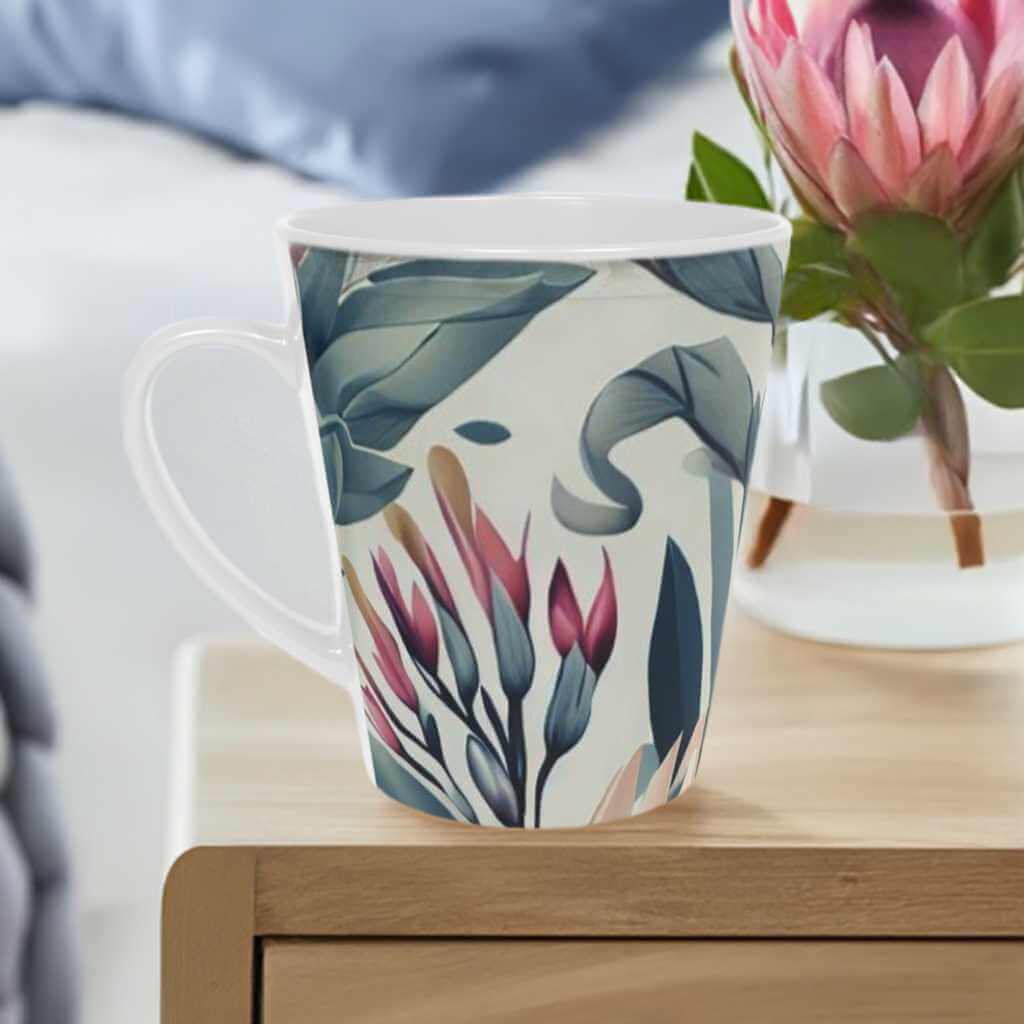 Bohemian Garden 12oz scratch resistant ceramic latte mug- sage green and burgundy floral pattern on a white background - Free shipping in Canada. Perfect for enjoying your favorite hot drink in style. Order now! Pictured on a side table beside a vase of pink protea flowers